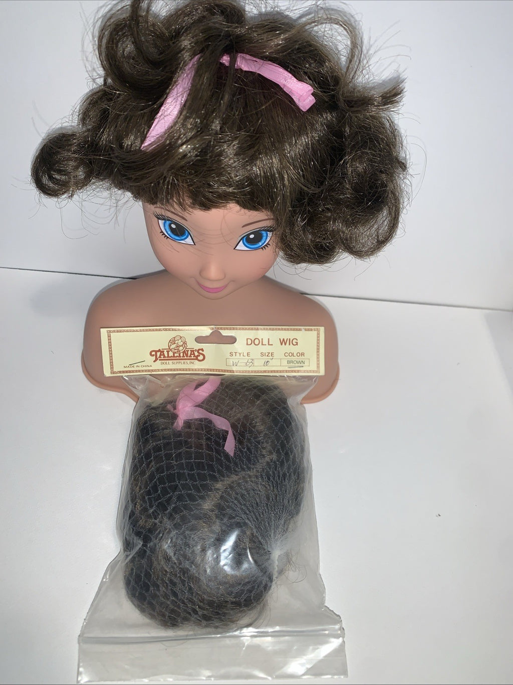 TALLINAâs Doll Wig 10â Stretchable Dark Brown Short Curly Pink Ribbon Ponytail